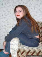 Teen redhead posing and showing shaved pussy