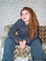 Teen redhead posing and showing shaved pussy