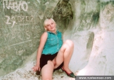Teen blonde shows her shaved pussy outdoor