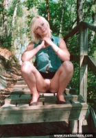 Teen blonde shows her shaved pussy outdoor