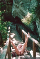 Teen blonde shows her shaved pussy outdoor