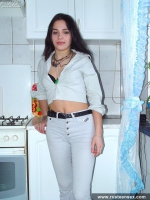 Russian teen brunette undressing in the kitchen