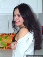 Russian teen brunette undressing in the kitchen