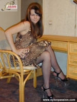 Cute stockinged brunette posing nude