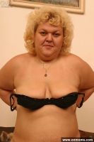 Mature blonde masturbates with a toy