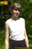 Pissing outdoor in the summer forest