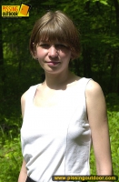 Pissing outdoor in the summer forest