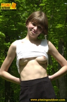 Pissing outdoor in the summer forest