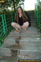 Pissing on outdoor concrete ladder