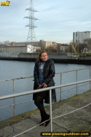 Pissing on the bridge over river