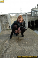 Pissing on the bridge over river