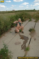 Pissing outdoor in rural fields