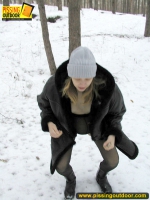 Pissing outdoor in the winter forest