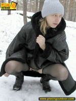 Pissing outdoor in the winter forest