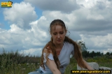 Outdoor pissing on a rock pile in summer day
