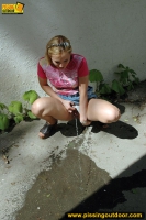 Outdoor pissing of teen girl cannot get into a house