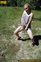 Outdoor pissing on the road wetting it with pee