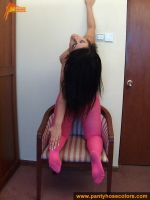 Magenta pantyhose with over worn panties on teen brunette