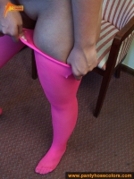 Magenta pantyhose with over worn panties on teen brunette