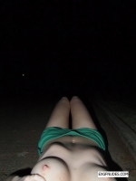 Redhead posing naked outdoors