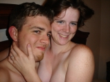 American couple posing to ranch