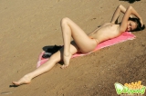 Teen strips outdoors