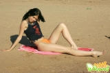 Teen strips outdoors
