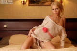 Hot blonde in her bedroom
