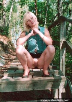 Teen blonde shows her shaved pussy outdoor - N