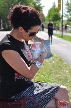 Brunette babe smoking at the park - N