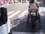 Naked woman on-bike