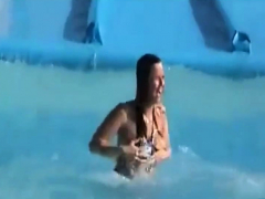 Tiny tits and ass exposed on the waterslide