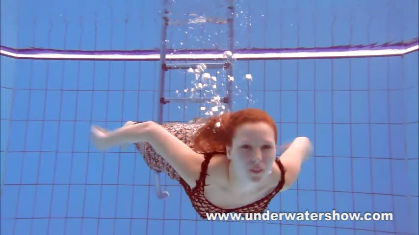 Redheaded Katka playing underwater