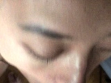 Asian bimbo sucks on a big cock close up